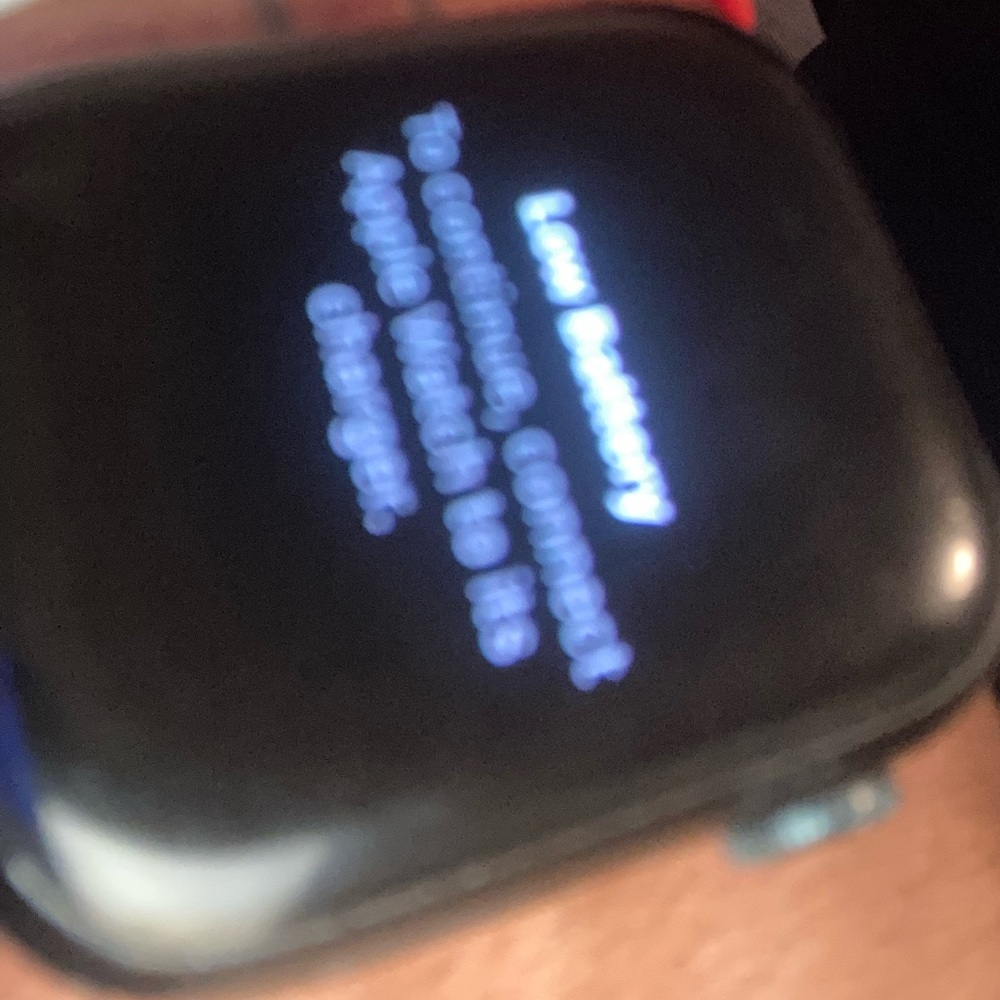 Black Smartwatch with Red and White Band
